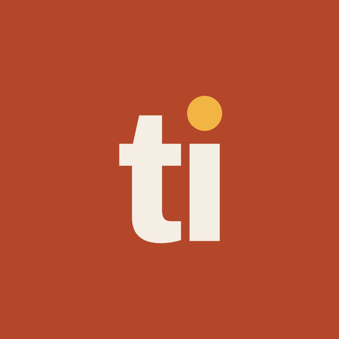 El isotipo de Tiuxs: las letras ti, con el punto de la i en mostaza